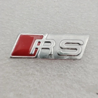 LOGO AUDI RS 26x9MM PLATA