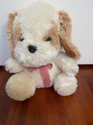 Peluche cane morbido con fiocco