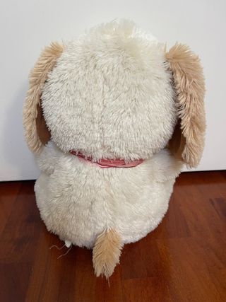Peluche cane morbido con fiocco