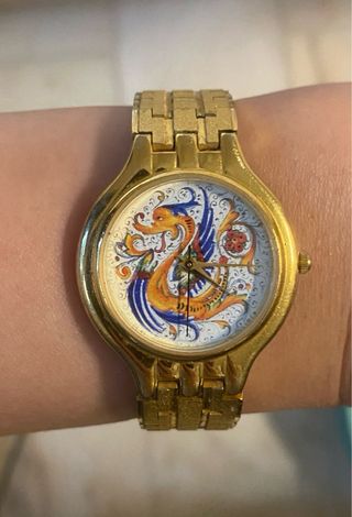 Orologio vintage dorato con drago