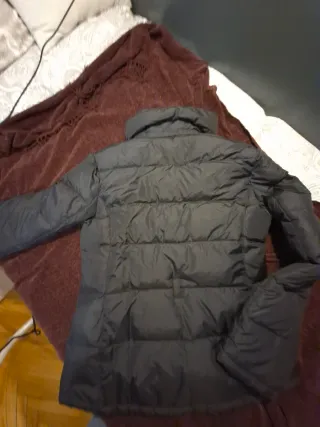 Plumifero corto negro