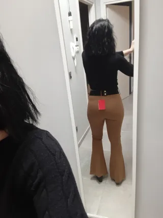 Pantaloni a zampa stile vintage – vita alta