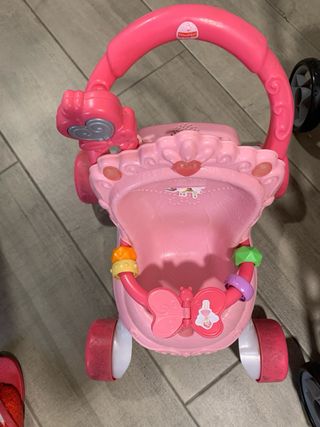 Cochecito de juguete rosa