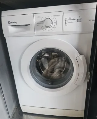 Muebles, lavadora y camas