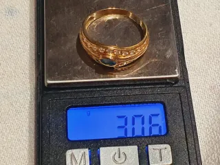 Anillo y pulsera oro 18k con circonita.