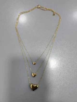 H529 Collana tre fili con cuori inox oro lucida