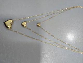 H529 Collana tre fili con cuori inox oro lucida