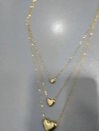 H529 Collana tre fili con cuori inox oro lucida