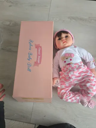 Bambola reborn con vestitino e accessori