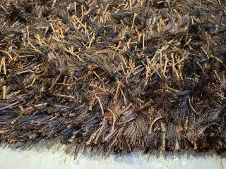 Alfombra Impecable marrón y negra