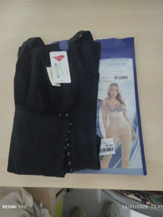 Faja reductora negra con broches libre de pechos.