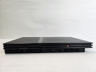 PlayStation 2 Slim + 2 Giochi SingStar