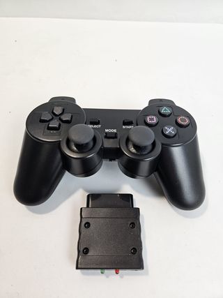 PlayStation 2 Slim + 2 Giochi SingStar