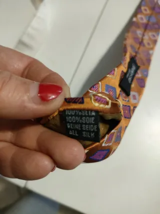 Cravatta fantasia geometrica arancione e viola