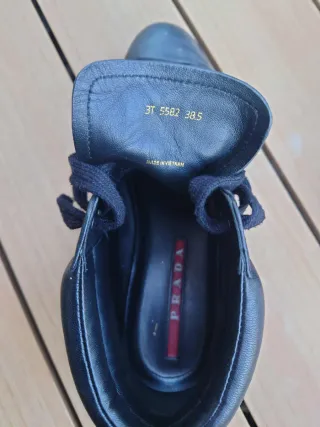 Scarpe Prada nere alte