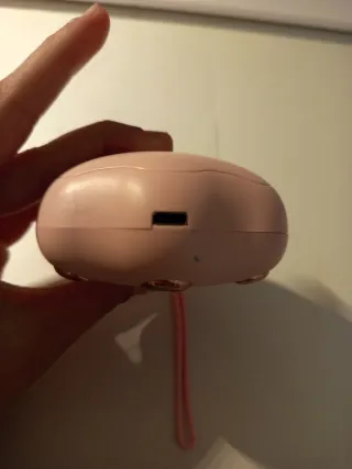 Calentador de manos rosa con diseño de patita