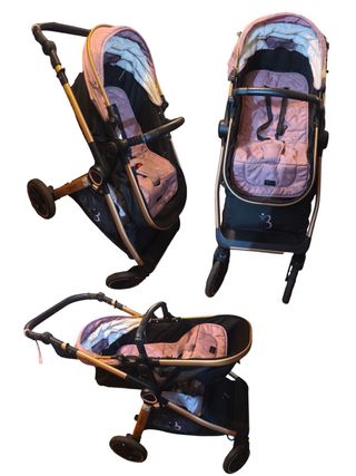 Carrito de bebé rosa y dorado