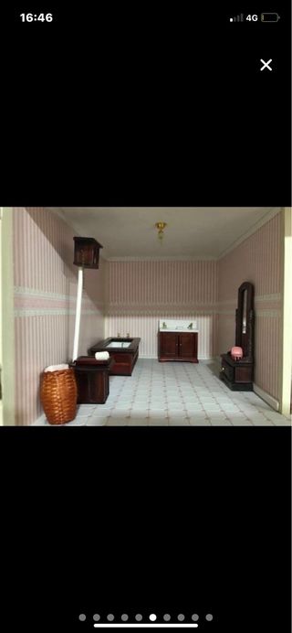 Casa de muñecas de madera