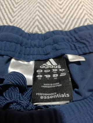 Pantalones Adidas deportivos azul y blanco