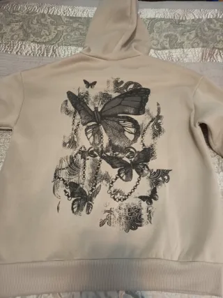 Sudadera beige con estampado