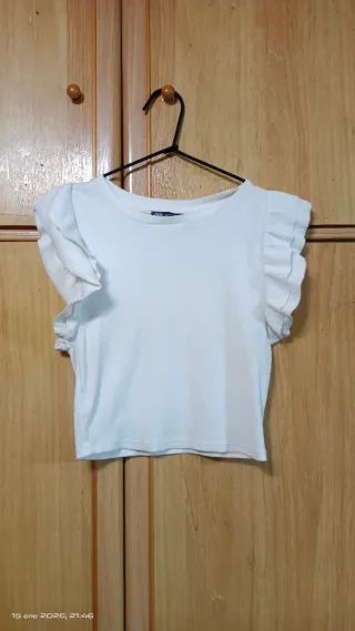 Top naranja con volantes