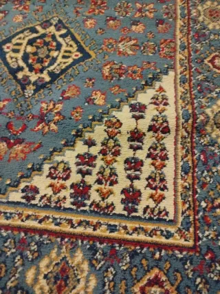 Tappeti persiani e Valigia Samsonite Nera