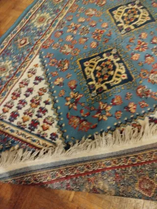 Tappeti persiani e Valigia Samsonite Nera