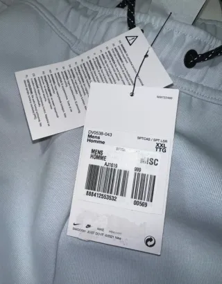 Pantalón Nike Tech Gris/Rosa