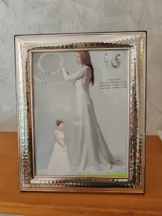 Cornice in argento martellato