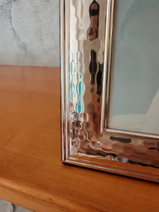 Cornice in argento martellato