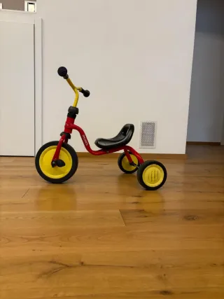 Triciclo Puky rosso e giallo