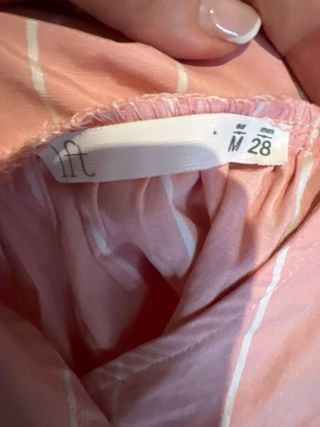 Blusa rosa con rayas blancas