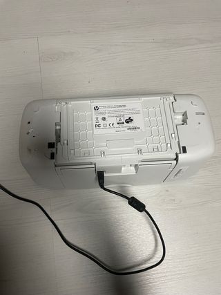 Impresora HP multifunción azul y blanca