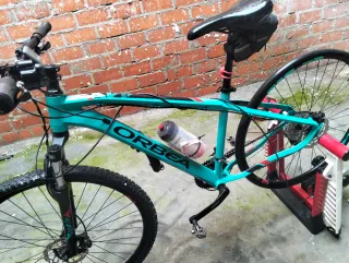 Bicicleta Orbea color turquesa mas rodillo