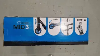 Patinete Decatlon en caja.