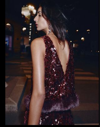 Top lentejuelas granate  con pelo