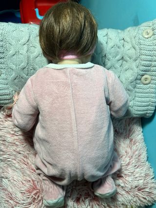 Bambola realistica neonata con ciuccio