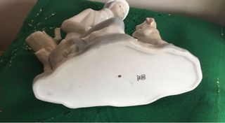 Figura Nao niño con perro porcelana