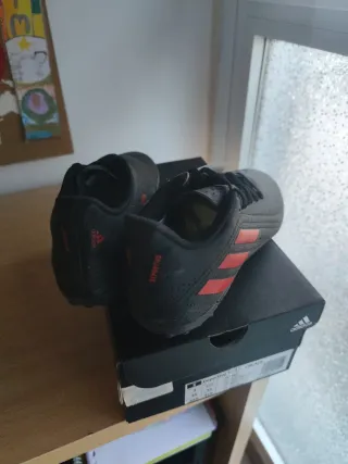 Botas fútbol niño Adidas multitacos negras T3