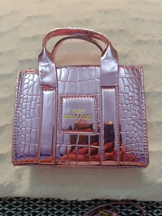 Bolso rosa metalizado efecto piel