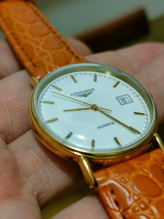 Reloj Longines Dorado y Naranja