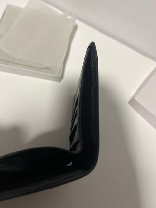 Cartera negra unisex de la marca Cortefiel