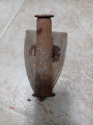 Plancha antigua de hierro fundido