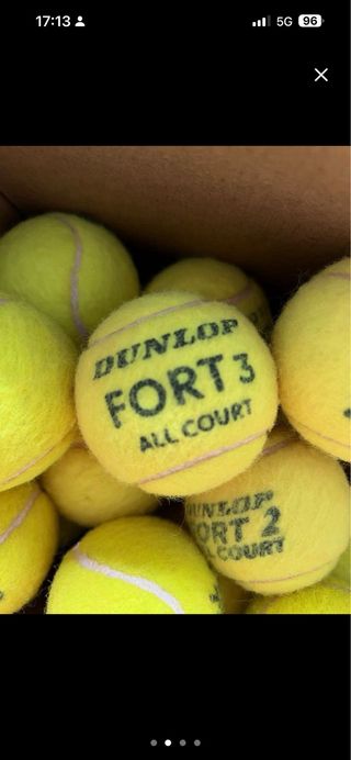 50 pelotas de tenis seminuevas.