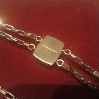 Conjunto de 2pulseras plateadas acero y un collar