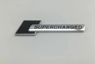 EMBLEMA SUPERCHARGED AUDI NEGRO