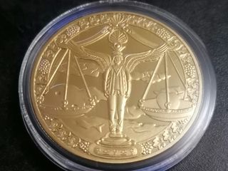 Moneda Libra Escala Dorada