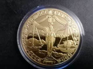Moneda Libra Escala Dorada