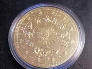 Moneda Libra Escala Dorada