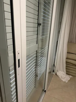 Puerta corredera doble cristal 4 hojas